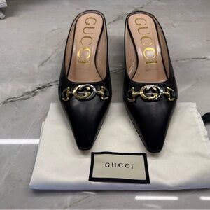Gucci Black Mules with Gold Detailing